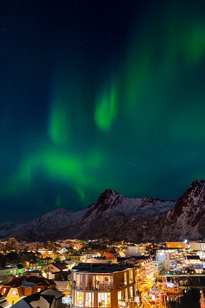 Aurora over the town of Svolvaer on the Lofoten Islands in Norway in winter with snow covered mounta by Robert Ruidl