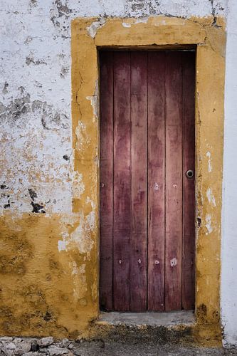 Decayed door with yellow frame