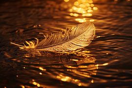 Golden feather floating on water at sunset by Art & Soul Creations