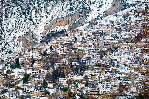City high on a mountain slope in the snow