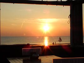 View from beach pavilion on sea at sunset