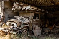 Old dusty car in open storage