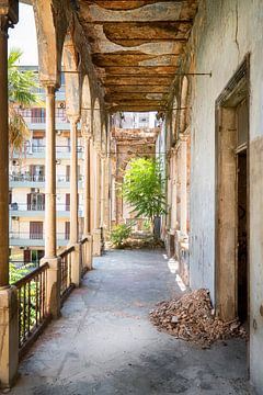 Corridor with city view in abandoned palace.