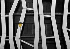 Architectural photograph of façade with street lighting in Pamplona, Spain by Wim Schuurmans