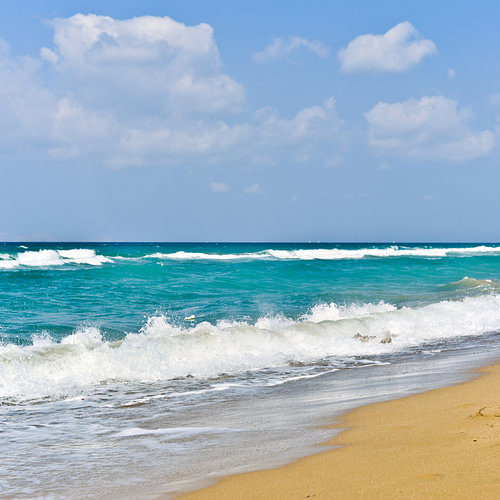A dynamic interplay of waves on the Cretan beach at Amoudara