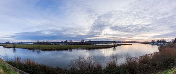 Sunset over a small lake by Mart Houtman
