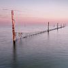 Fishing nets in the Markermeer during sunset by Allkindsofscapes