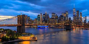 New York City Skyline - View on the Brooklyn Bridge in the evening by Tux Photography