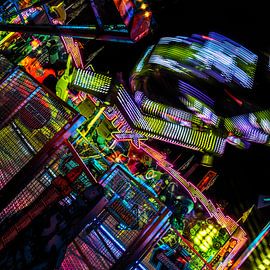 Rotierende Lichter – Karussell als abstrakte Langzeitbelichtung von Mixed media vector arts