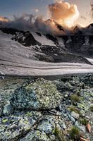 Stones, glaciers and sunny clouds
