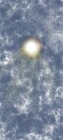 The radiant sun through the clouds.