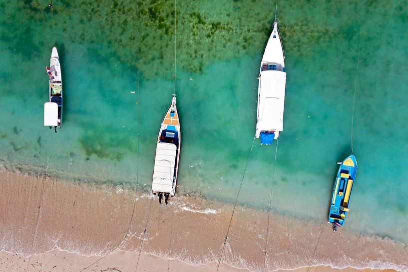 Top shot of traditional boats in the harbor on Bali in Indonesia by Eye on You