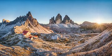 Dolomites with the Three Peaks in the atmospheric sunset