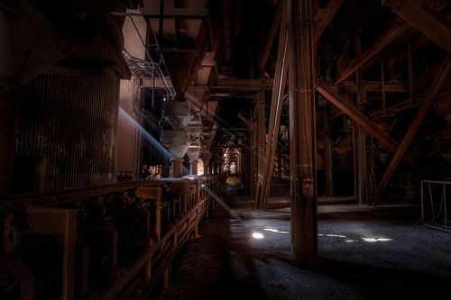 Ray of light in an abandoned blast furnace by Eus Driessen
