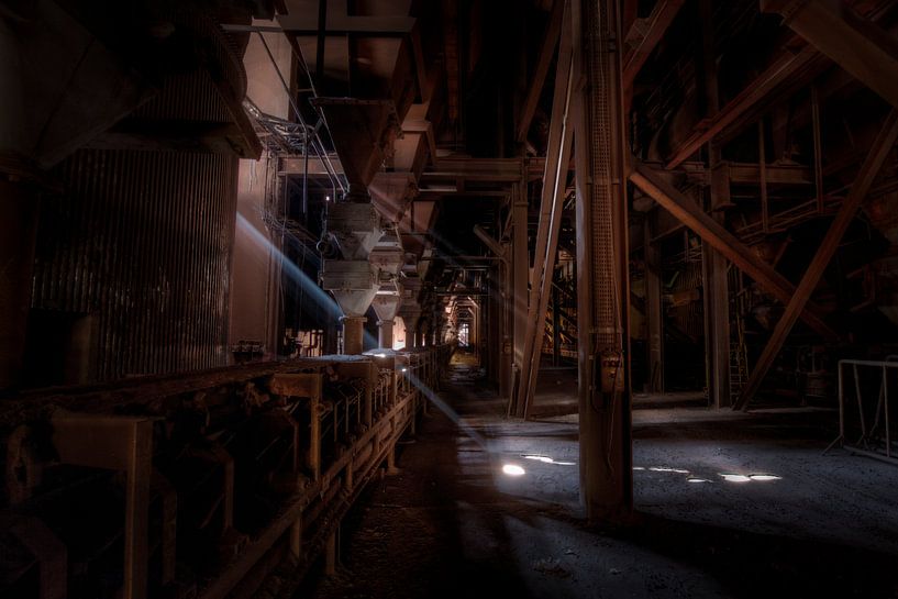 Ray of light in an abandoned blast furnace by Eus Driessen