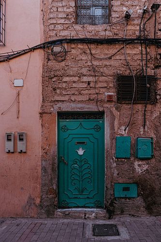 A turquoise door full of hidden stories