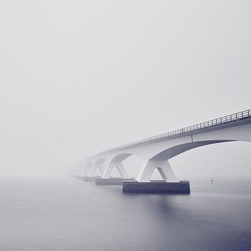 The Zeeland Bridge in the mist by Photodoos