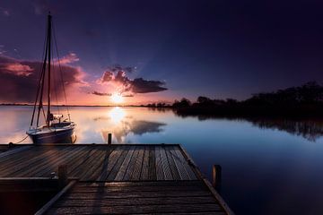 Sailboat at wooden jetty by Jef Folkerts