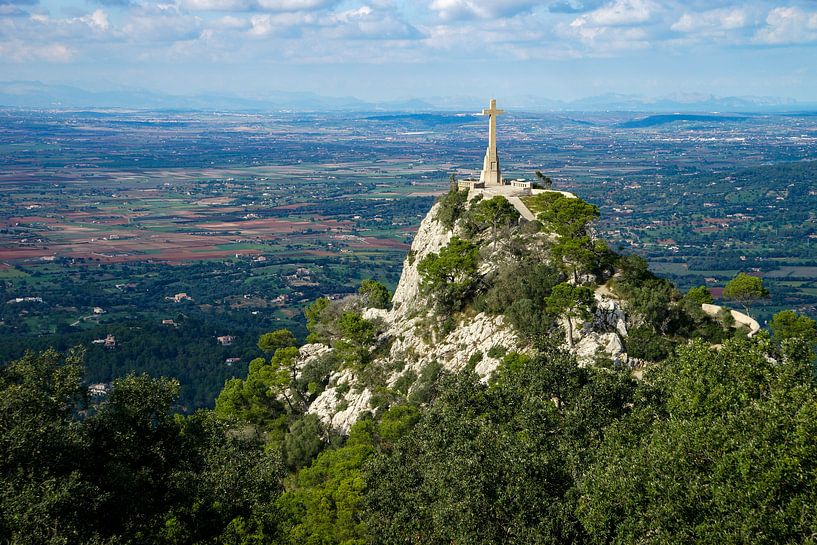 View from Sant Salvador (Mallorca) to a cross statue in front of landscape with mountains in the bac by Hans-Heinrich Runge