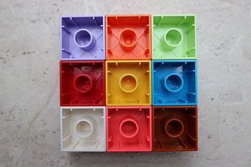 Nine (9) square toy blocks lying upside down colourful (rotation 4)