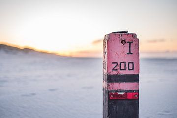 Het strand van Ameland tijdens zonsondergang.