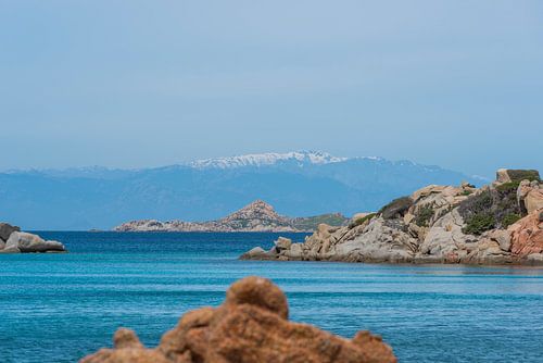 the beautiful island of maddalena , compared with the maledives, with blue sea and the mountains as 