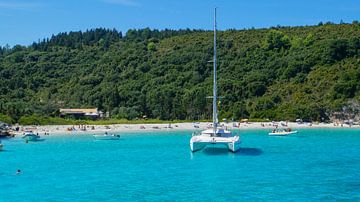 Sailing ships on paradise like turquoise water of greek island corfu bay in summer by adventure-photos