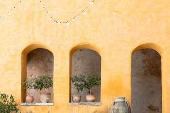 ochre wall with alcoves and terracotta pots - Mediterranean ambience