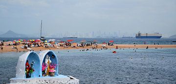 View of the beach and the city in the distance by Claude Laprise