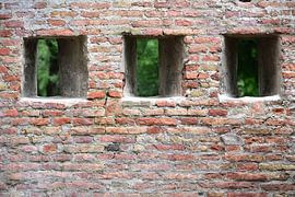 Three openings in an old stone wall by Ulrike Leone