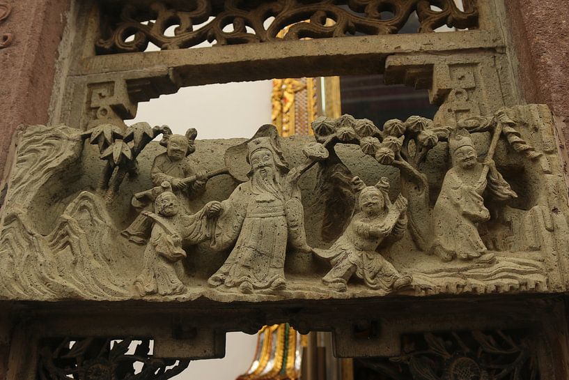 Bas-relief with sculptures of a happy family at Wat Pho, Bangkok, Thailand. by kall3bu