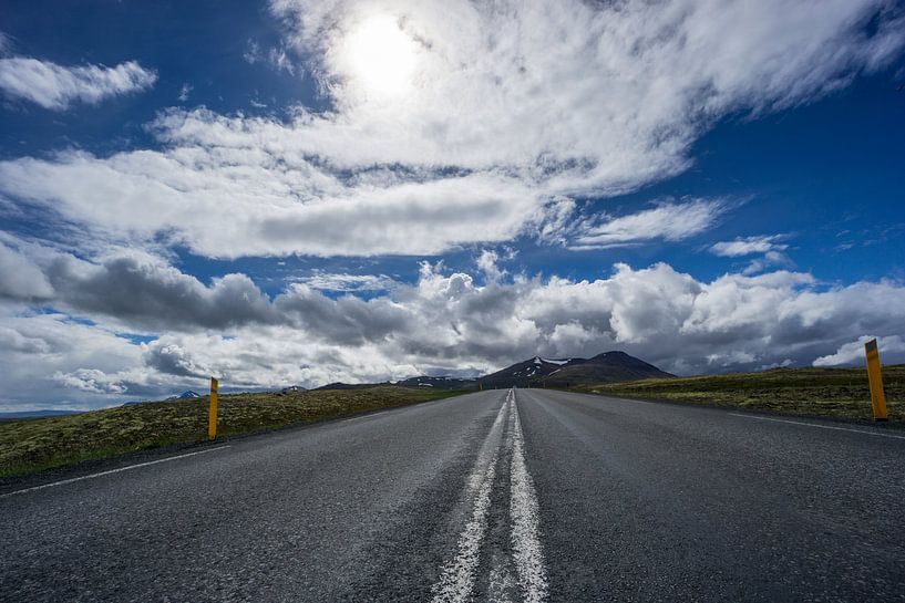 Iceland - Sunshine over straight road between icelandic volcanic landscape by adventure-photos