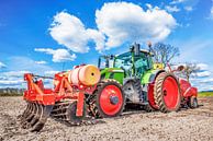 Green tractor sowing potatoes by Günter Albers thumbnail