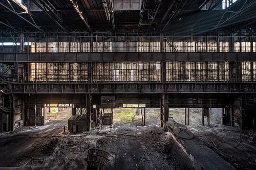 An abandoned factory hall near a steel factory