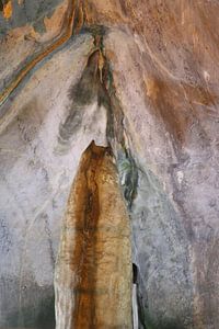Devil meets two angels in heaven. A dripstone closeup in a cave.