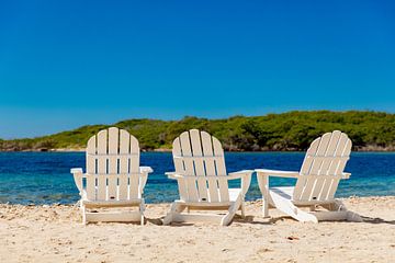 Wooden beach chairs on Curacao by Laura V