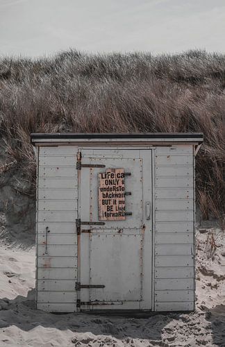 Het bericht op de strandcabine.
