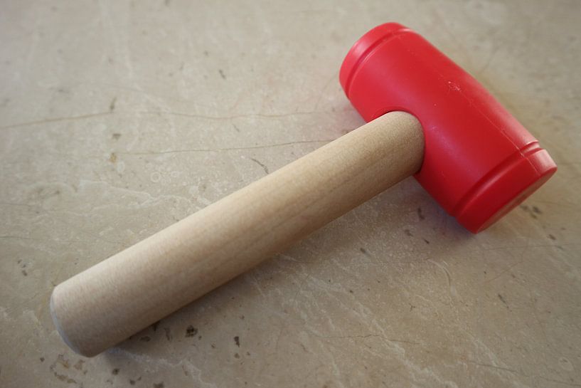 Toy hammer lying down by hou2use