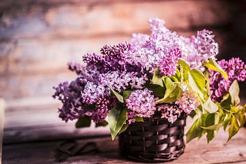 Bouquet of lilacs against wooden background by BeeldigBeeld Food & Lifestyle
