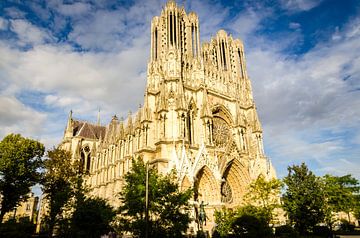 Facade and bell tower with nave of the Gothic cathedral of Reims France by Dieter Walther