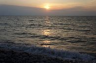 Beautiful sunset on a pebble beach in Brittany France by Sandra van der Burg thumbnail
