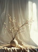 Beige vase with branches in sunlight