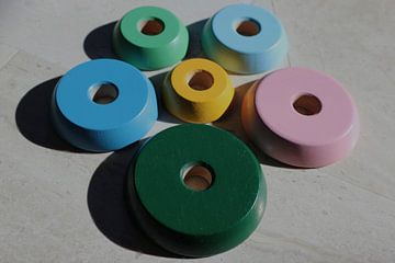 Toy discs around each other with shadow