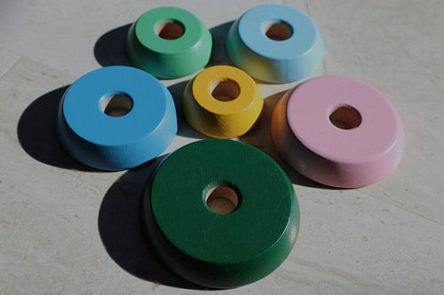 Toy discs around each other with shadow