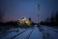 Abandoned signal box on desolate railway yard