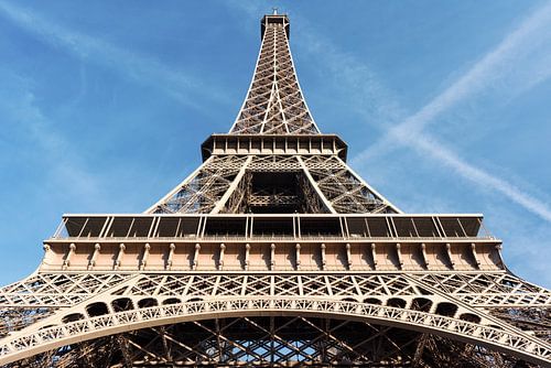 Eiffel tower in Paris against blue sky by Lorena Cirstea