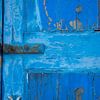 Abstract weathered blue entrance door on Malta by Jille Zuidema