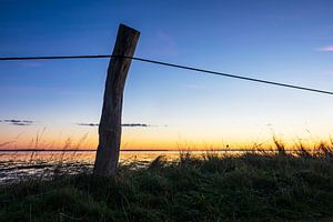 Landscape with sunrise on the North Sea island Amrum, Germany sur Rico Ködder