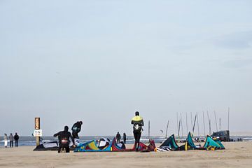 kitesurfers on the beach by Liesbeth Vogelzang