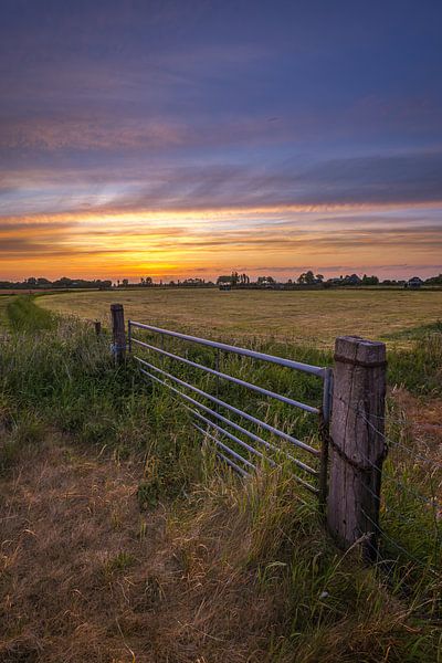 Fence at sunrise in Akersloot by peterheinspictures